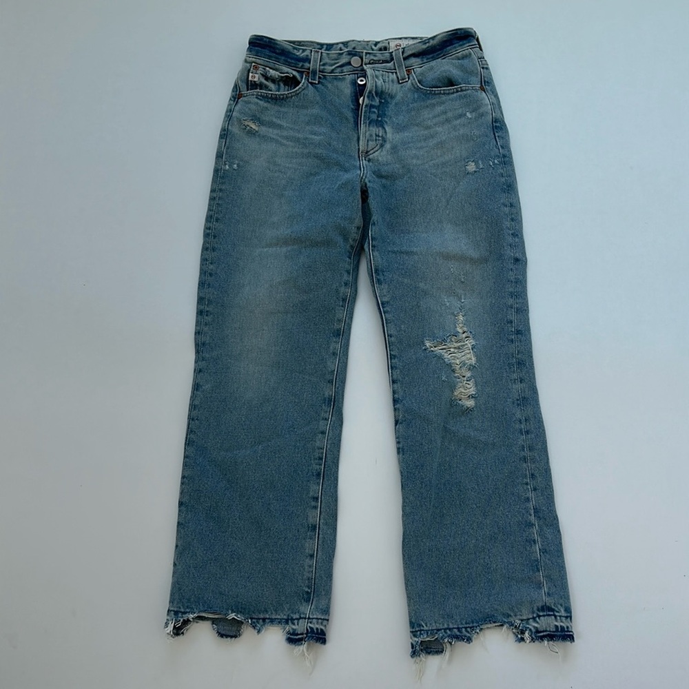 Light blue ripped jeans.